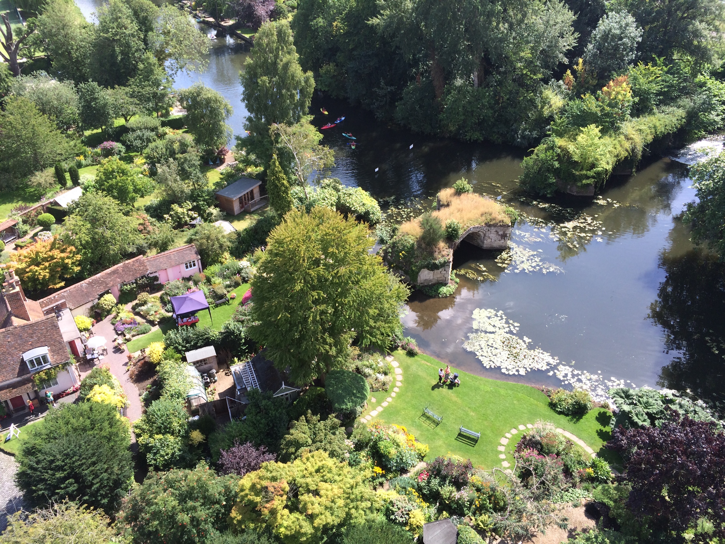 View of a lush garden area from the top of Warwick Castle