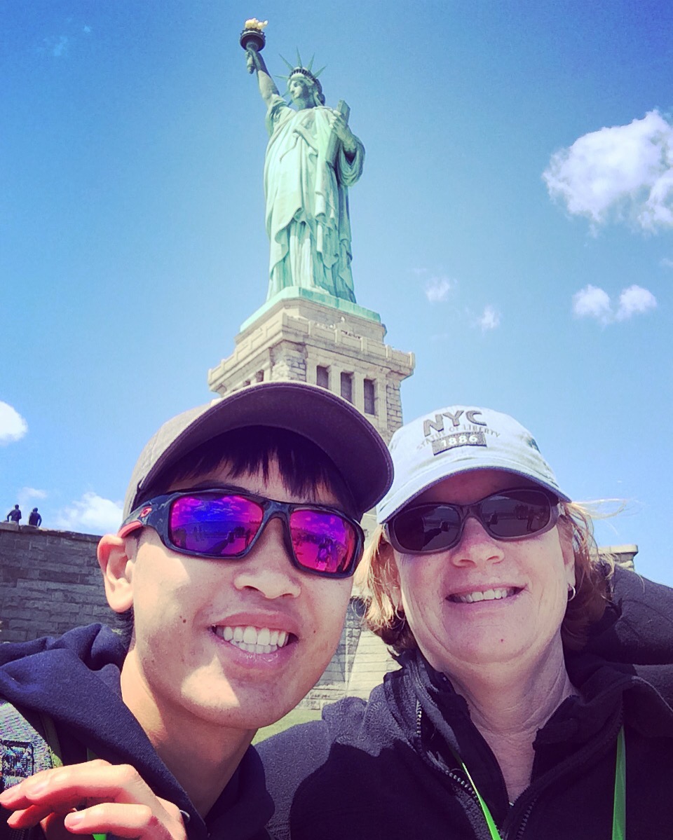 Mom and me in front of the Statue of Liberty.