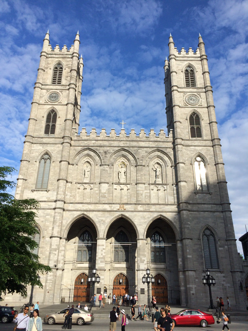 Notre Dame facade lit up by the sun