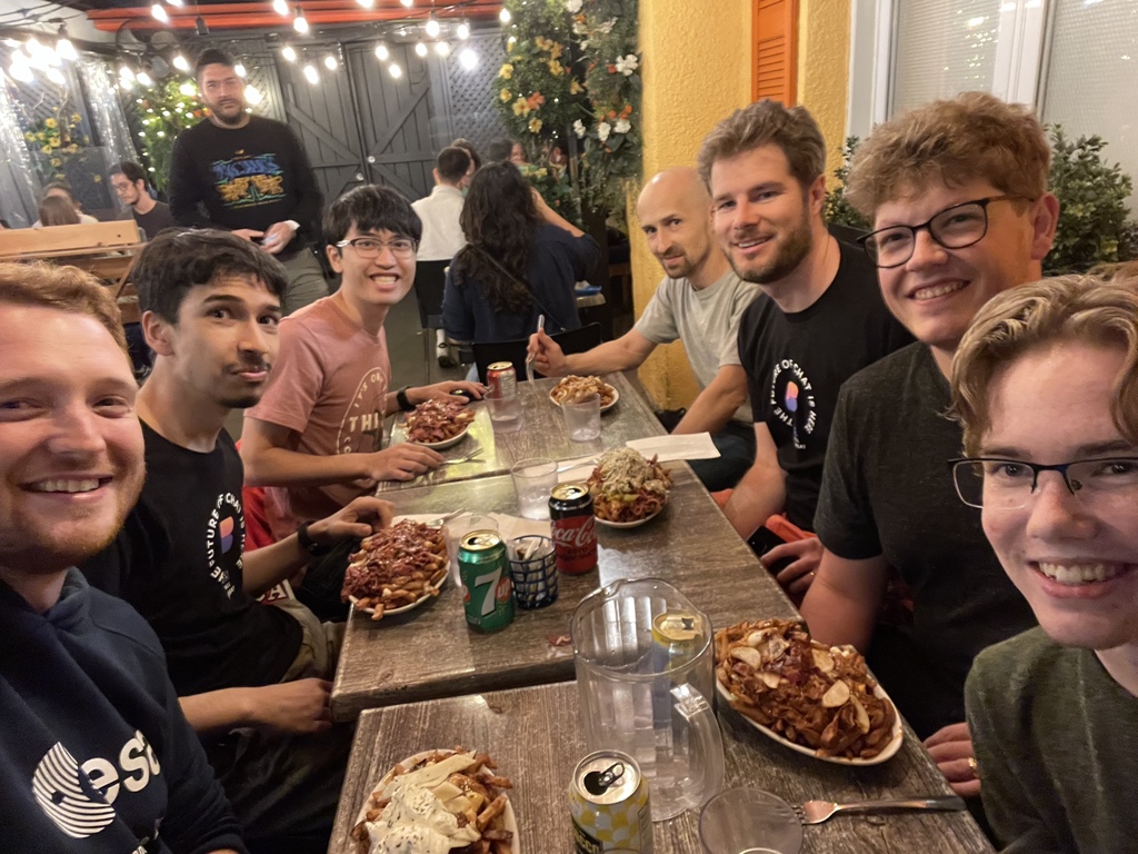 The team eating poutine