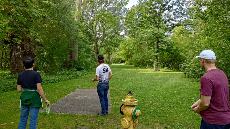 Adam (center) getting ready to throw while Tulir (left) and Josh (right) look on.